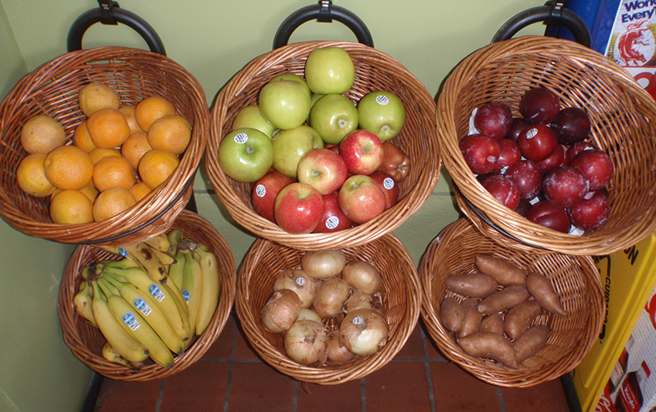 a bowl of fruit sitting on a table