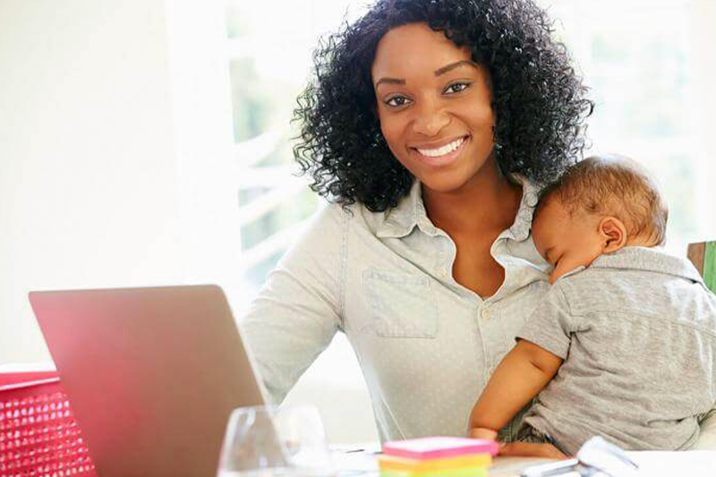 Woman with baby working